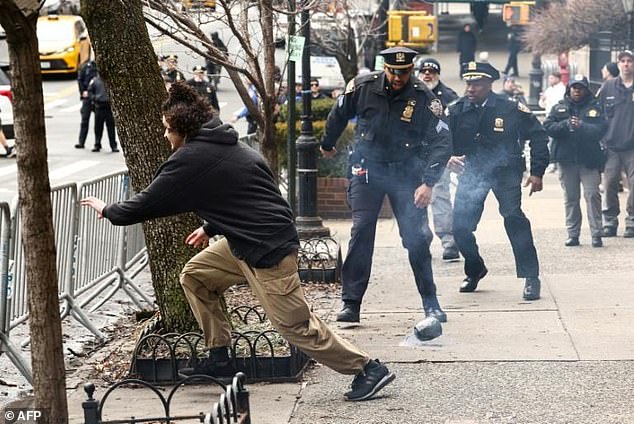 NYPD Officer's Viral Barrier Leap Sparks Reflection on Heroism and Institutional Focus During Crisis