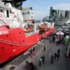 Tense Standoff in Mediterranean as Libyan Coast Guard Fires on Humanitarian Ship, Threatening Migrants and Crew